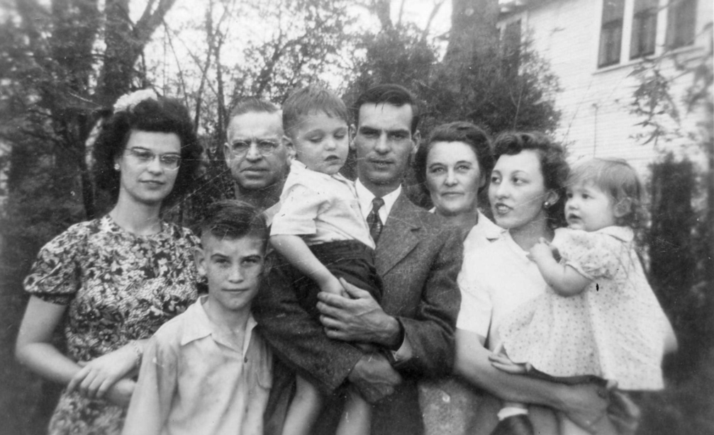 One of the pictures in the back yard before Sam left for the Navy.  Left to right are Nita, Bill Sam Sr.(Pop), Sam III (Skipper), Sam Jr. Mom (Netta), Virginia and Betty.  No one looked happy and the other pictures are worse.